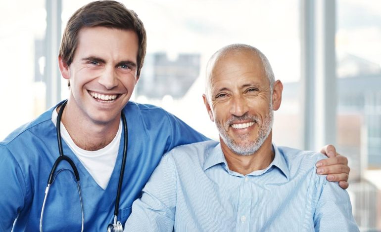 The bond between patient and practitioner. Portrait of a male nurse caring for a senior patient