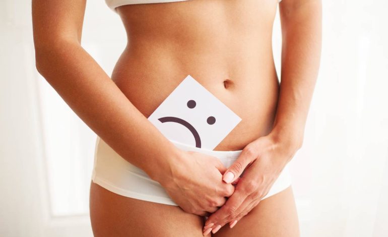 Woman Health. Female Body Holding Sad Smile Card Near Stomach