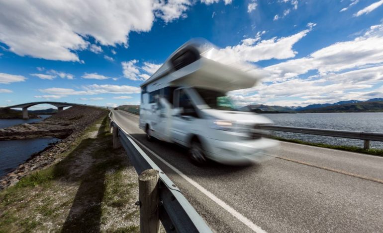 motorhome transported travels on the highway. Atlantic Ocean Road or the Atlantic Road (Atlanterhavsveien) been awarded the title as (Norwegian Construction of the Century).